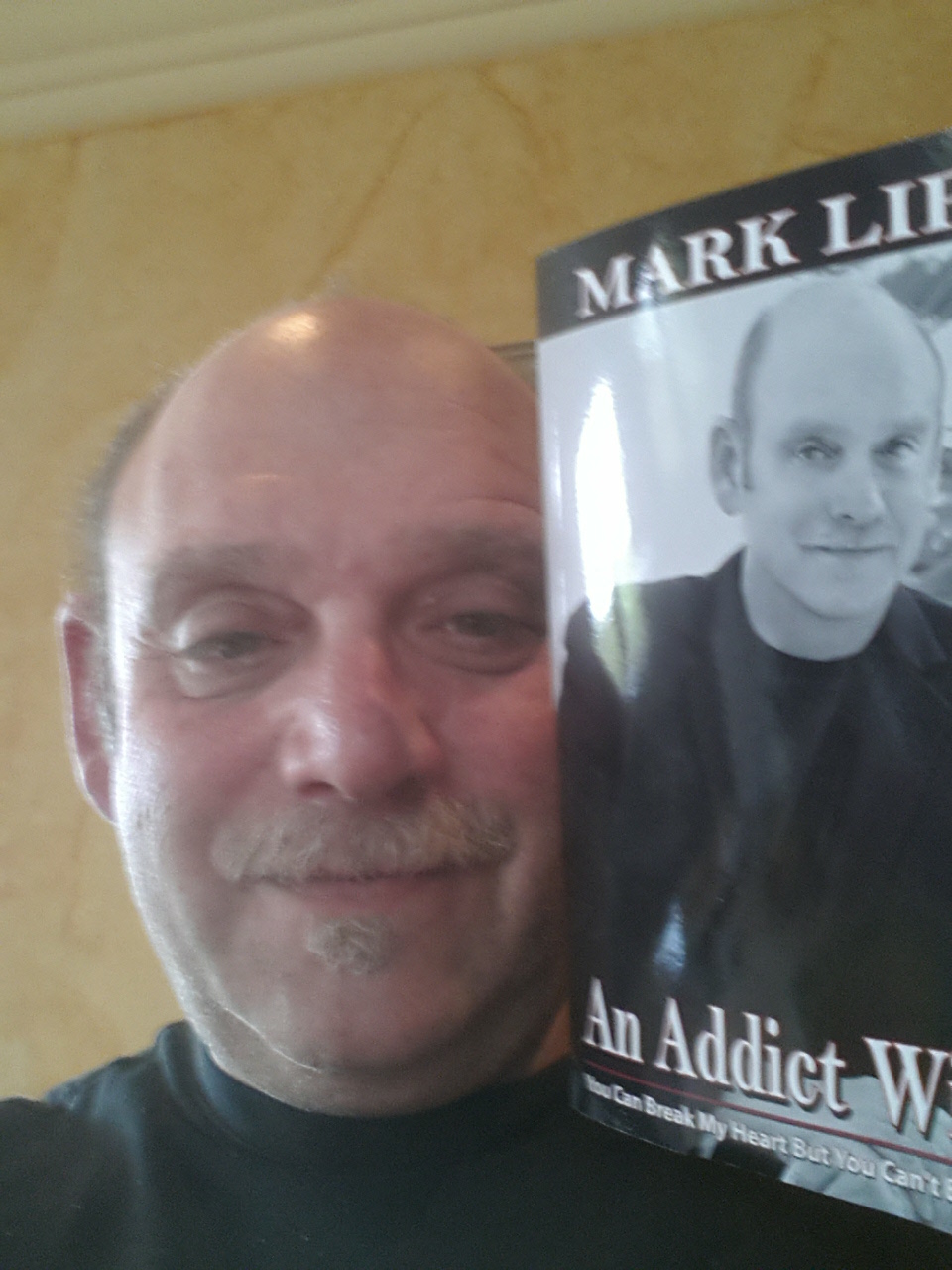 Selfie of Author Mark Lipp and his new book An Addict Within